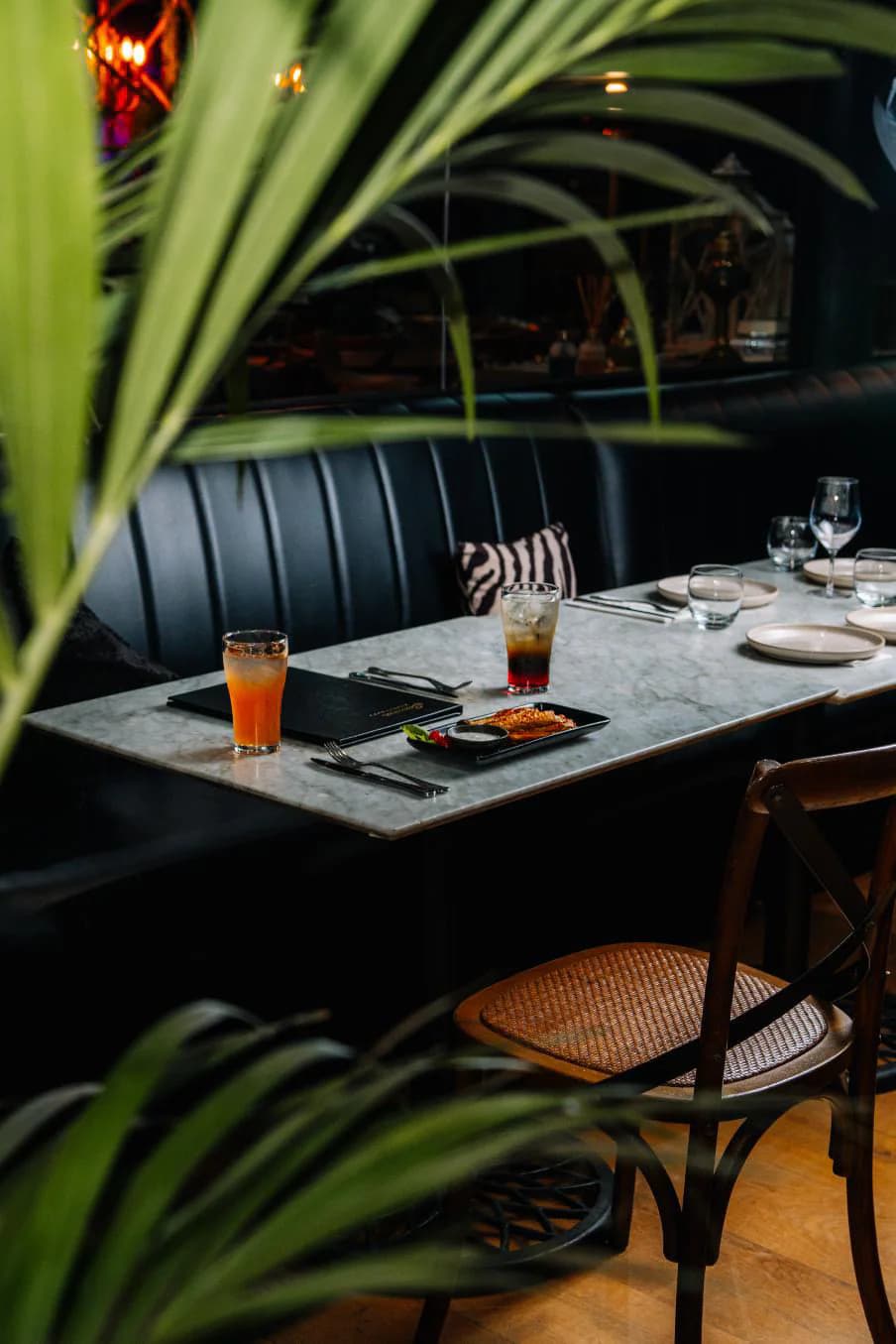 A dining table inside Summer Restaurant prepared for a gathering